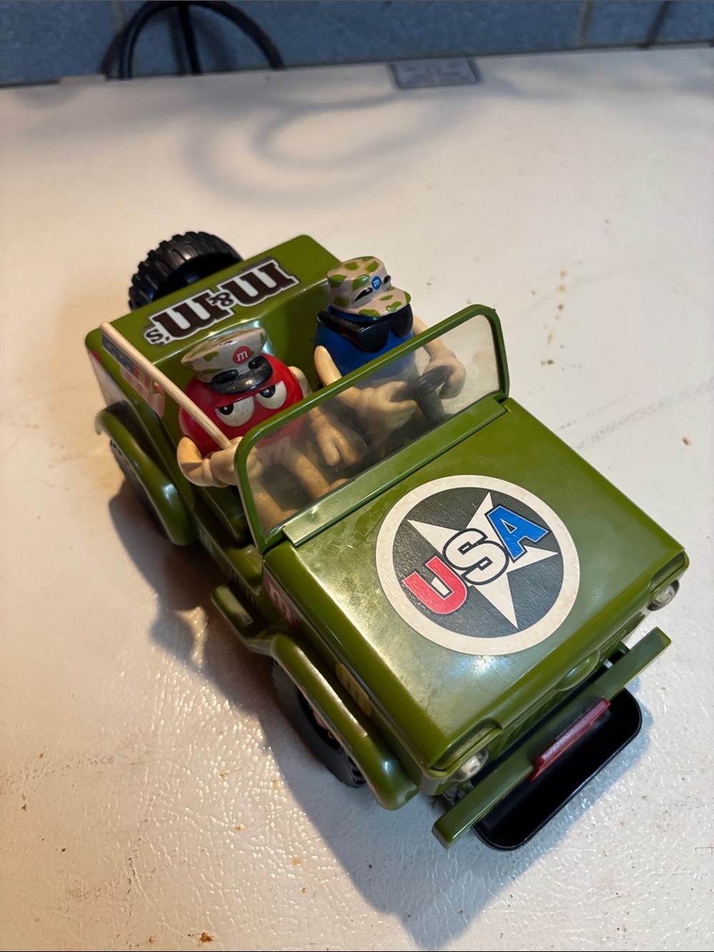 M&M'S Green Military-Style Jeep candy dispenser with Red and Blue M&M drivers